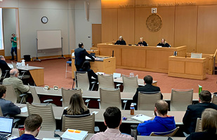 Image of an attorney presenting oral arguments to Ninth District Court of Appeals judges