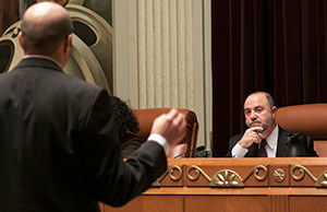 Joseph Caligiuri of the Office of Disciplinary Counsel (left) responds to a question from panel chair Paul DeMarco during a disciplinary hearing.