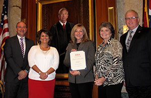 Barberton Municipal Court Administrator Susan Sweeney (center) received the 2012 Chief Justice Thomas J. Moyer Memorial Scholarship Award from the Ohio Association for Court Administration on October 18. With Sweeney are, from left, Judge David E. Fish, Judge Christine L. Croce, OACA President Sylvia Argento, and Ohio Judicial College Director Milt Nuzum.
