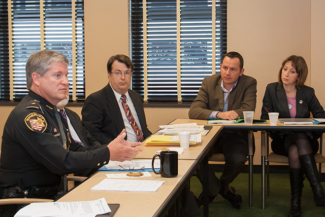 Warren County Sheriff Larry Sims (left) and Franklin County Assistant Prosecutor Jeff Rogers speak with Serbian delegates Dejan Kovacevic  and Tatjana Vasiljevic-Veljkovic during their visit to the Thomas J. Moyer Ohio Judicial Center. 