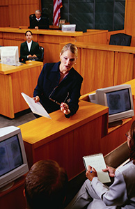 Image of an attorney arguing a case in a courtroom