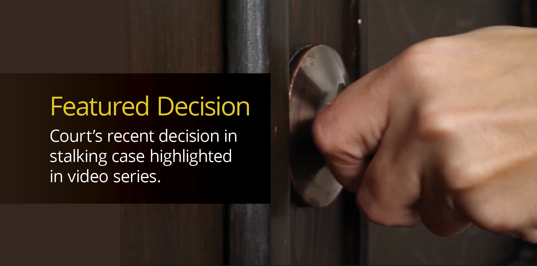 A hand on a doorknob.