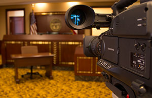 Federal courts continue experimentation with cameras as pilot project passes one-year mark.