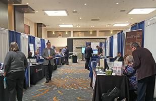 Image of vendor tables set up at a conference