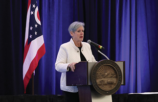 Image of Ohio Supreme Court Chief Justice Maureen O'Connor speaking from behind a podium
