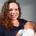 Image of Judge Michelle Fisher holding her newborn son