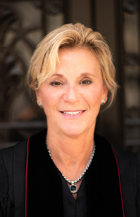 Image is a headshot photo of Judge-Appointee Dana Preisse in her black judicial robe