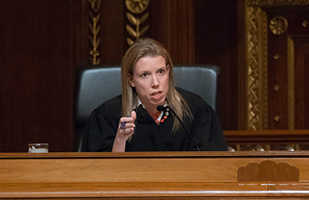Image of a female judge speaking from the bench in the Ohio Supreme Court courtroom