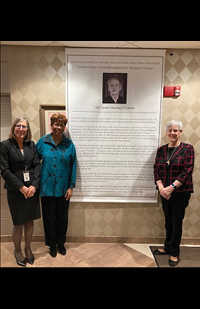 Image of Judge Linda Teodosio, Justice Melody Stewart, and Retired Chief Justice Maureen O'Connor standing next to a commemorative banner.