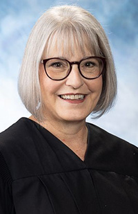 Image of a smiling female judge