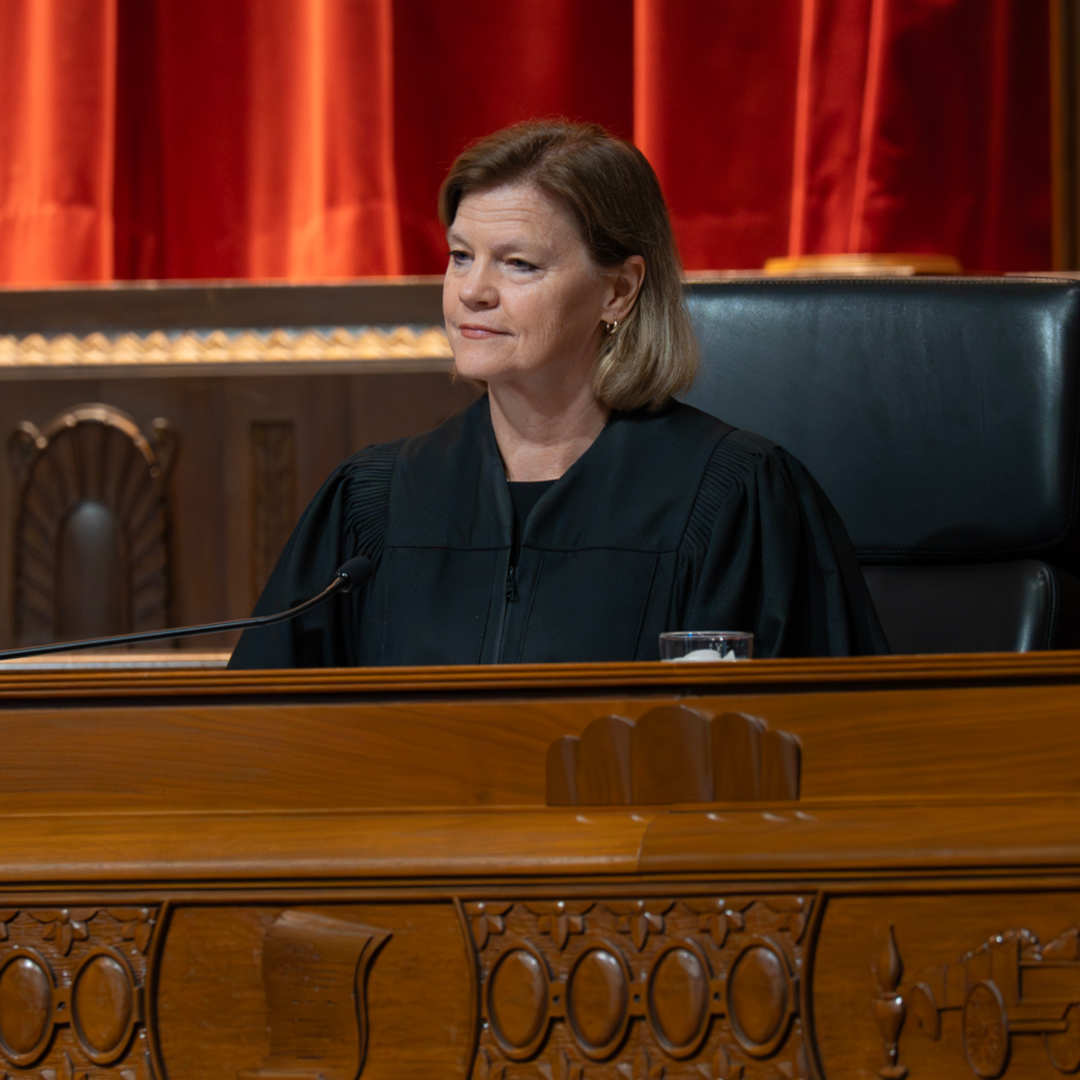 A woman judge sitting on the bench in the Thomas J. Moyer Ohio Judicial Center Courtroom