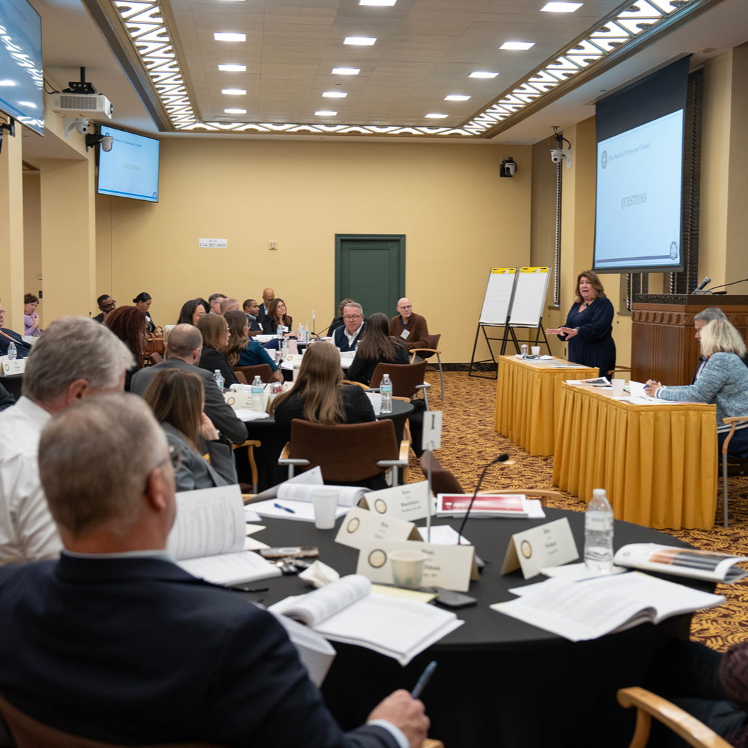 Female judge wearing a black judicial robe.