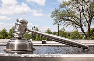 Image of the giant gavel in the south plaza reflecting pool at the Thomas J. Moyer Ohio Judicial Center