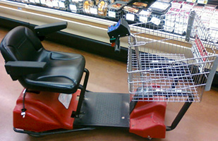 Image of a motorized shopping cart typically found in grocery and large retail stores
