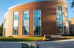 Image of the red-brick circular building of the University of Akron School of Law