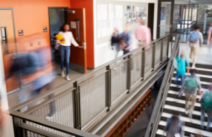Images of a school hallway, with students in the hallway and on a staircase