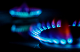 Image of several rings of blue gas flames.