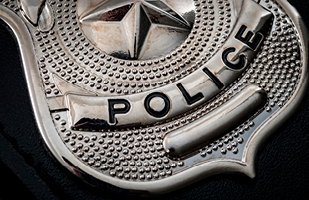 The bottom portion of a police officer's shield.