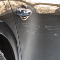 Close-up view of a car door handle.