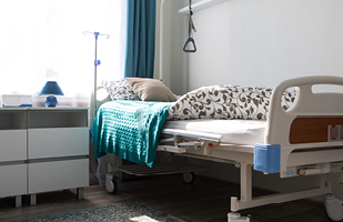 Image of a hospital bed in a nursing home.