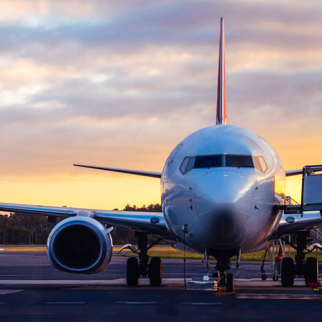 A commercial jet sitting on an airport runway.