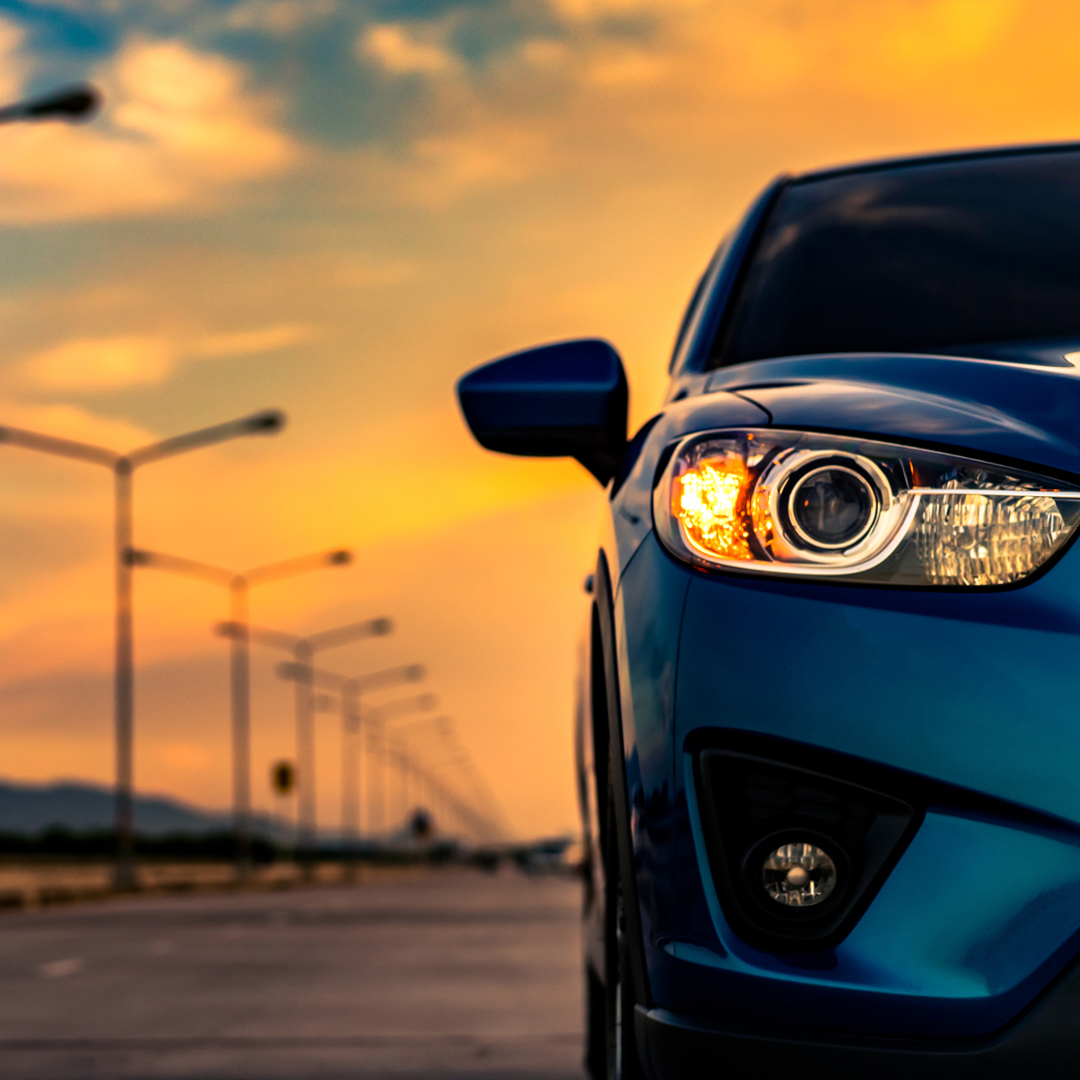 A woman wearing a black pin-stripe jacket holding a pen