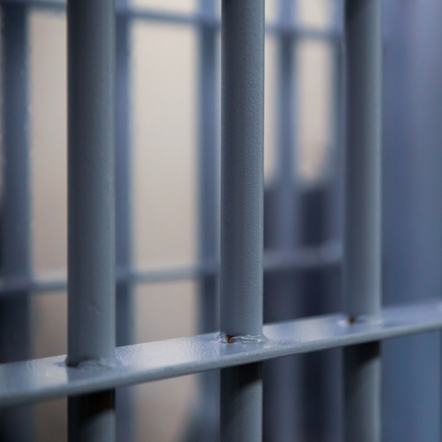 Grey, steel bars on a prison cell