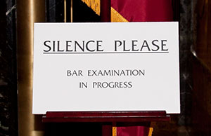 Image of a sign that says, 'Silence Please. Bar Examination in Progress.'