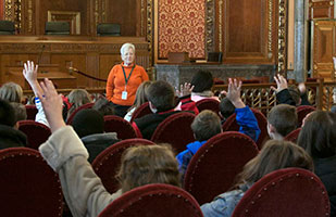 Image of students in the courtroom with a tour guide.