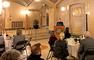 Image of Ohio Chief Justice Maureen O'Connor speaking to a group of people seated at tables in the Native American Lobby of the Thomas J. Moyer Ohio Judicial Center