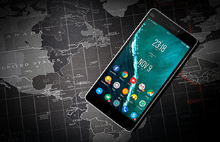 Image of a smartphone laying on top of a map of the world