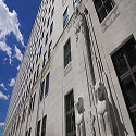 Exterior of Thomas J. Moyer Ohio Judicial Center looking toward a blue sky with clouds.