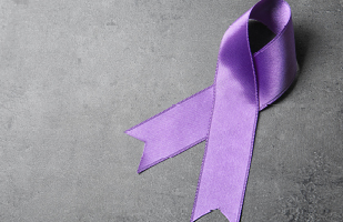 Image of a purple ribbon symbolizing support for domestic violence awareness.