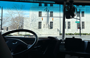 Image of the Thomas J. Moyer Ohio Judicial Center as seen from the driver's seat of a school bus.