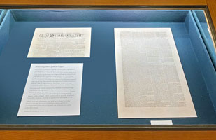 A display case containing historical documents.