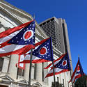 Ohio flags flying outside of the Ohio Statehouse