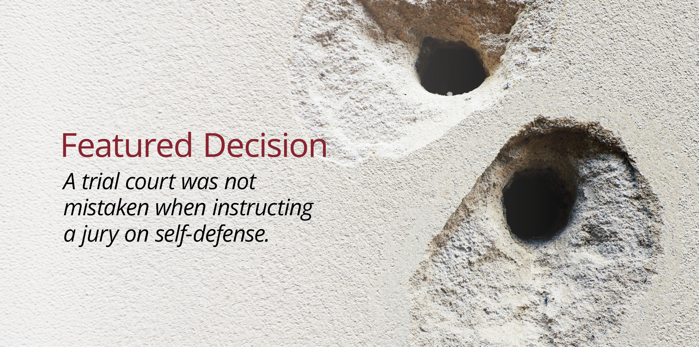 Two deeply gouged holes in a textured, light-colored concrete or stucco wall. The impact points feature dark, circular entry cavities in the center, surrounded by large, irregular areas where the outer surface material has chipped and crumbled away.
