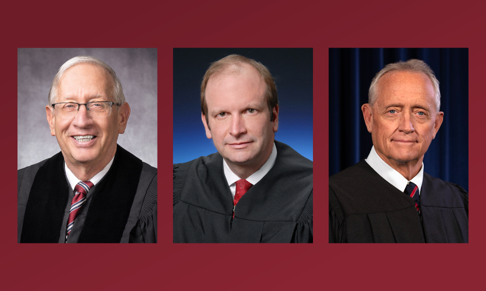 Image of three men wearing black judicial robes.