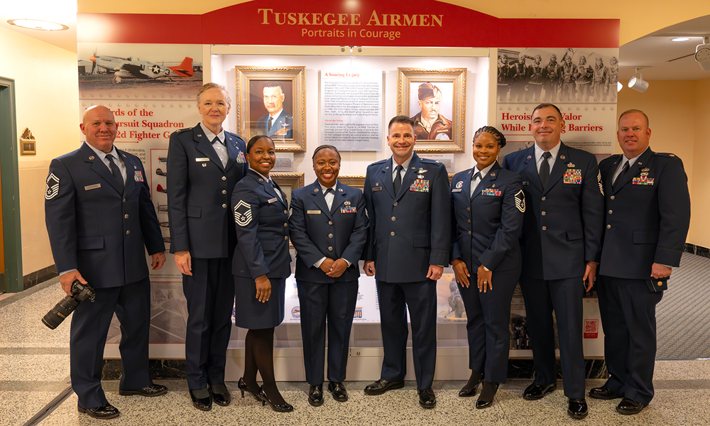 A row of men and women wearing Air Force dress uniforms.